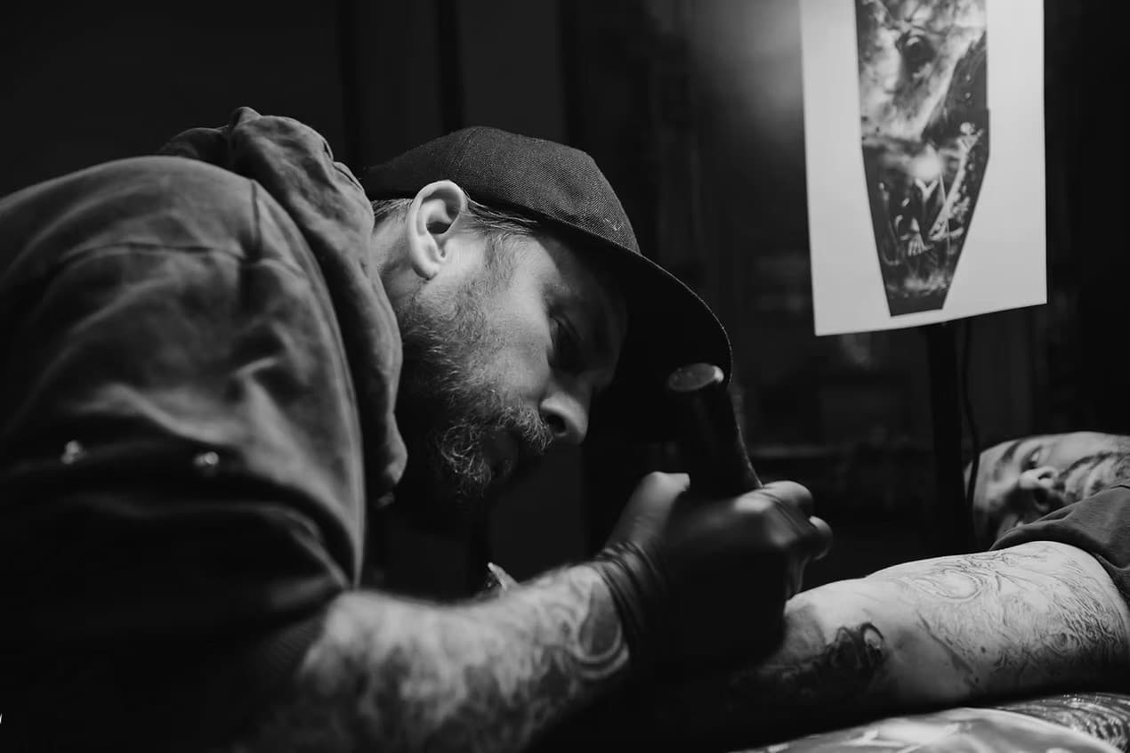 Liam Rebel tattooing in his private Sheffield studio