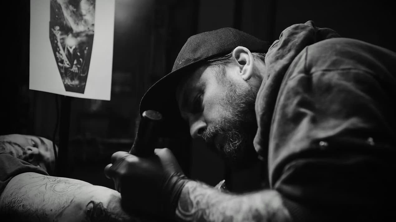 Liam Rebel tattooing a client in his Sheffield studio
