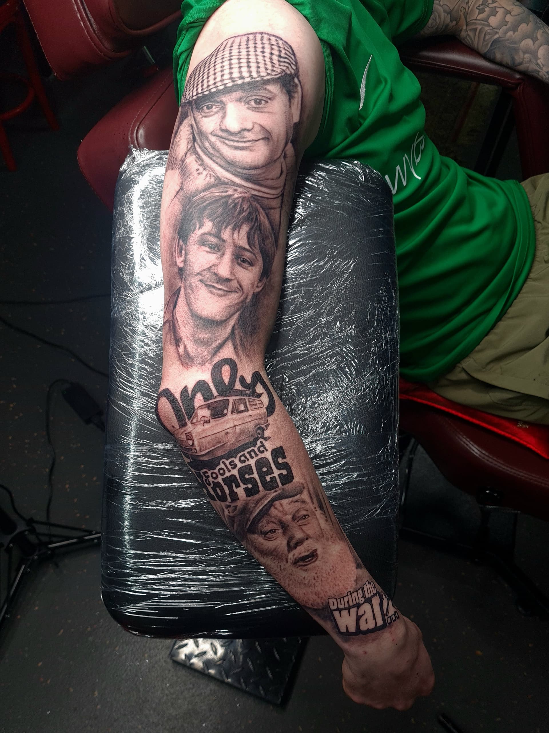 Black and grey realism tattoo sleeve of Only Fools and Horses characters and van on the arm