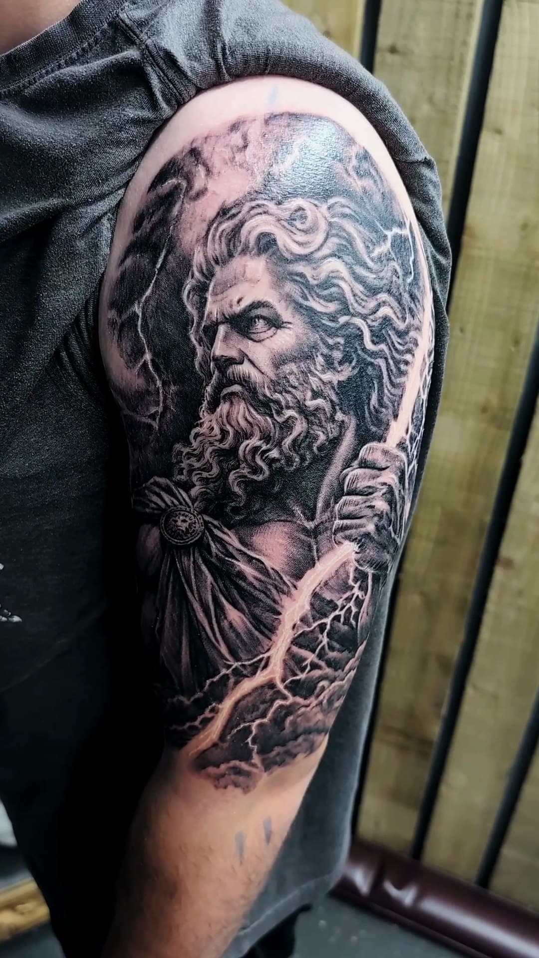 Zeus with lightning bolt upper arm tattoo, 6-hour session — cover photo