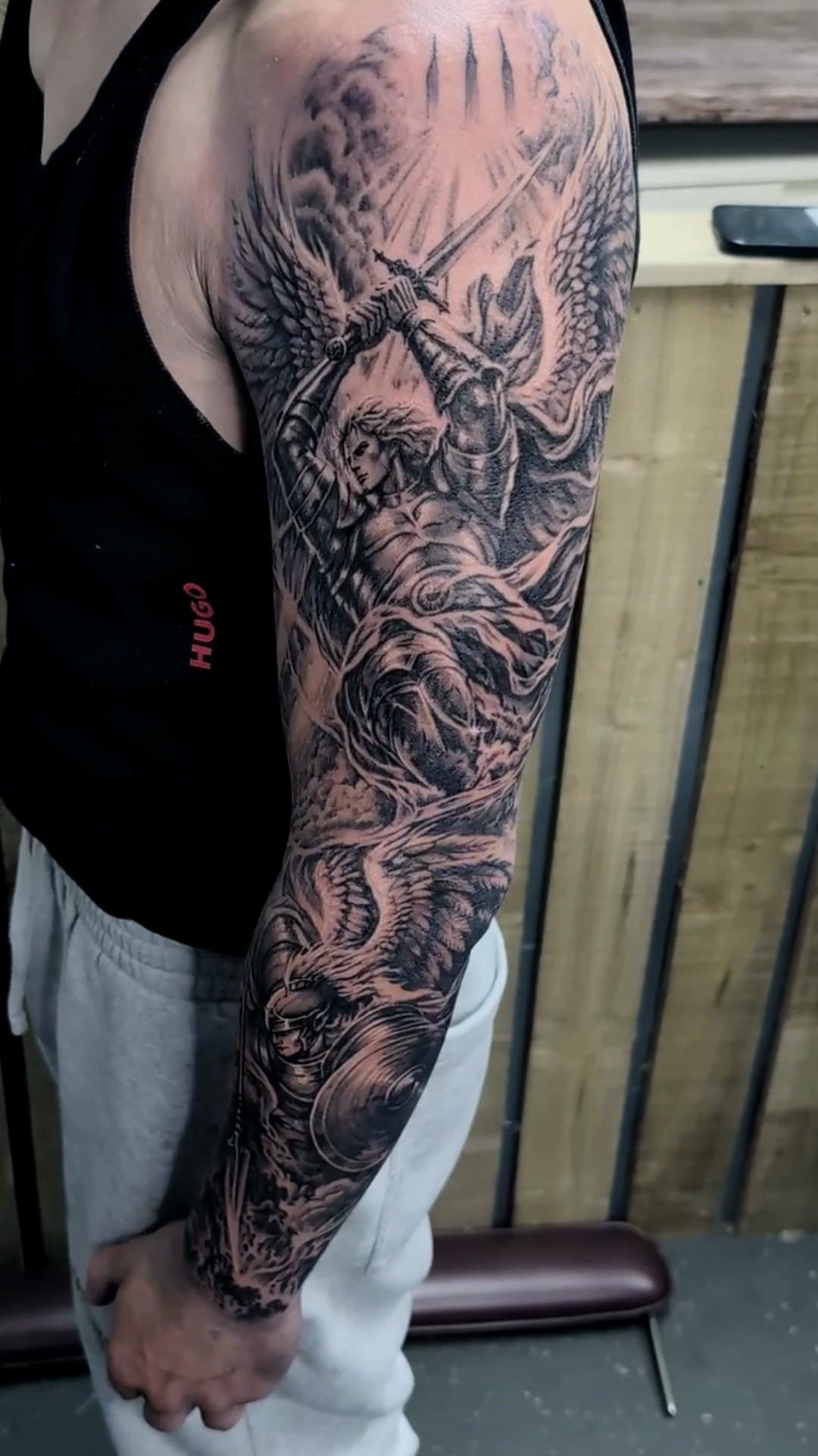 Heaven vs hell black and grey sleeve tattoo, 8-hour session — cover photo
